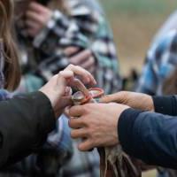 A student puts on gloves at the SAP.